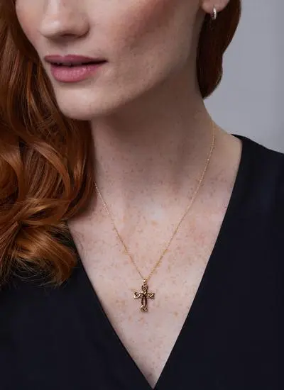 Close up of red haired model wearing 14ct Gold Celtic Cross Trinity Knot Pendant